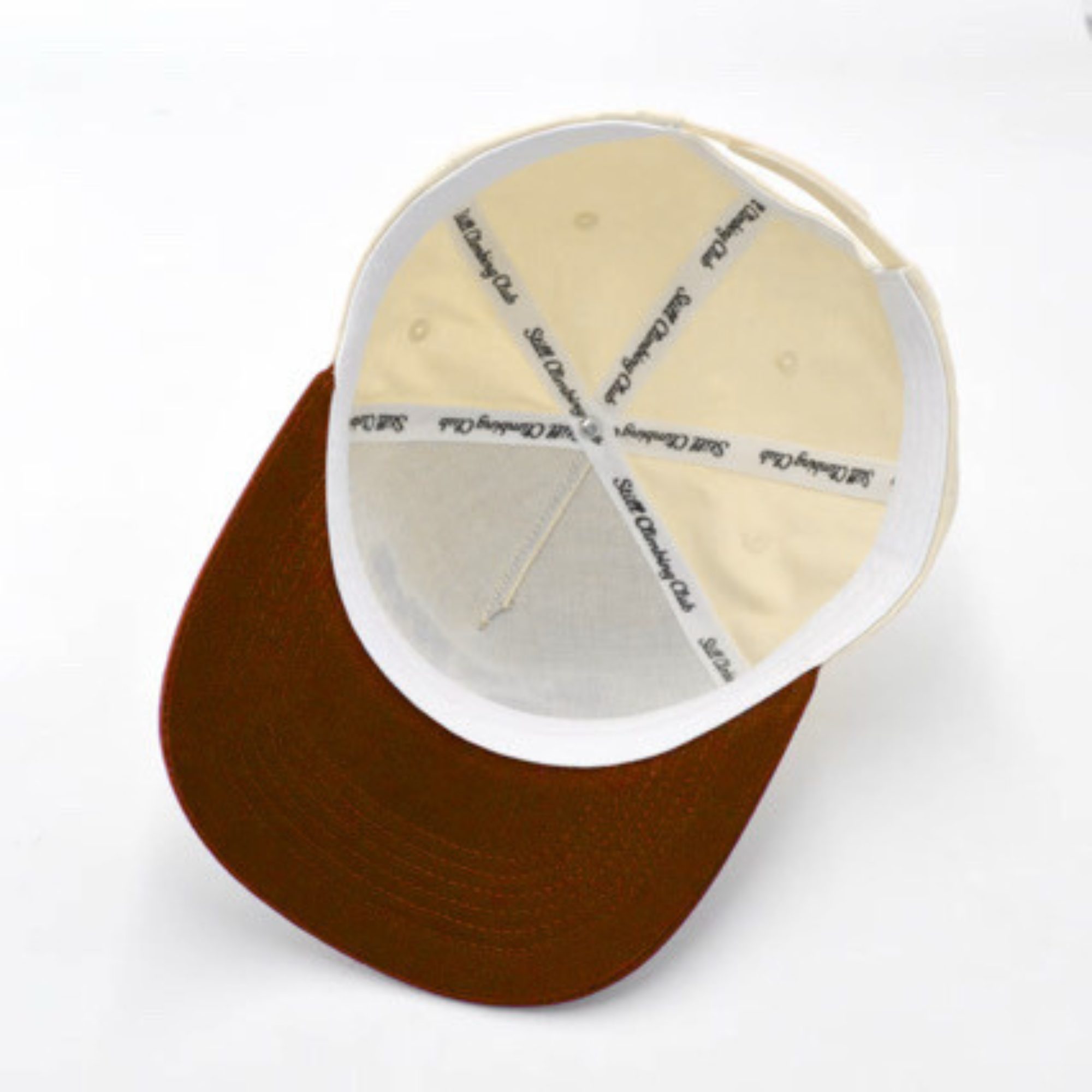 Brown and beige cap with white interior on a white background